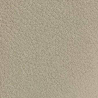 Nubuck leather texture sample, light beige, fine grain with mottled tone, matte finish, brand text “vismara > nabuk (extra) > na15”.